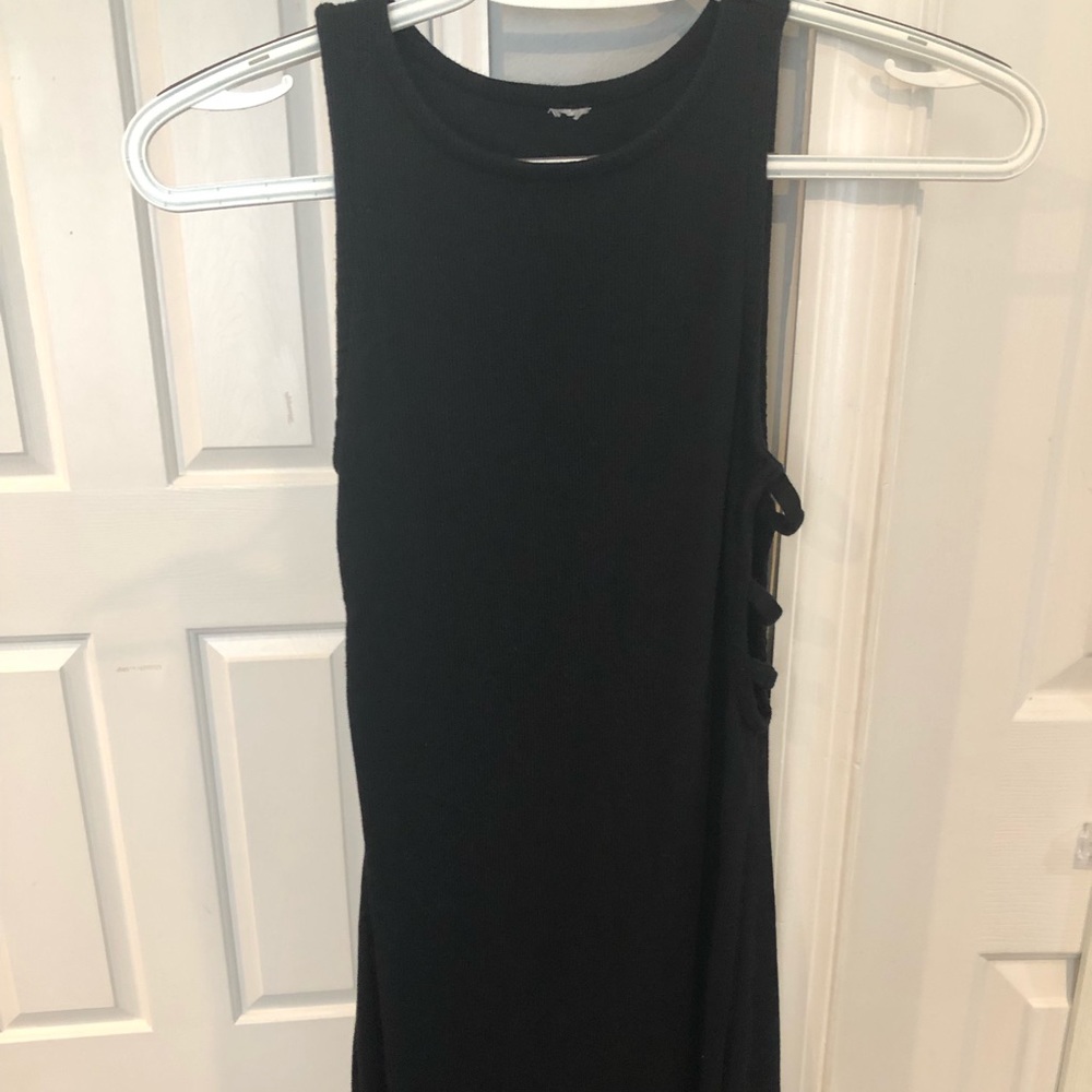 Tight black thick strap dress, cutouts along side
